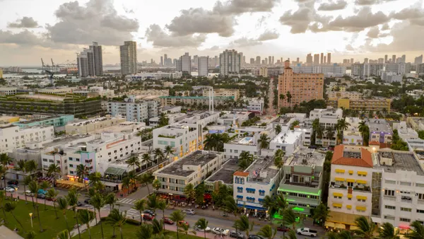 An aerial view of the Miami city skyline during sunset.