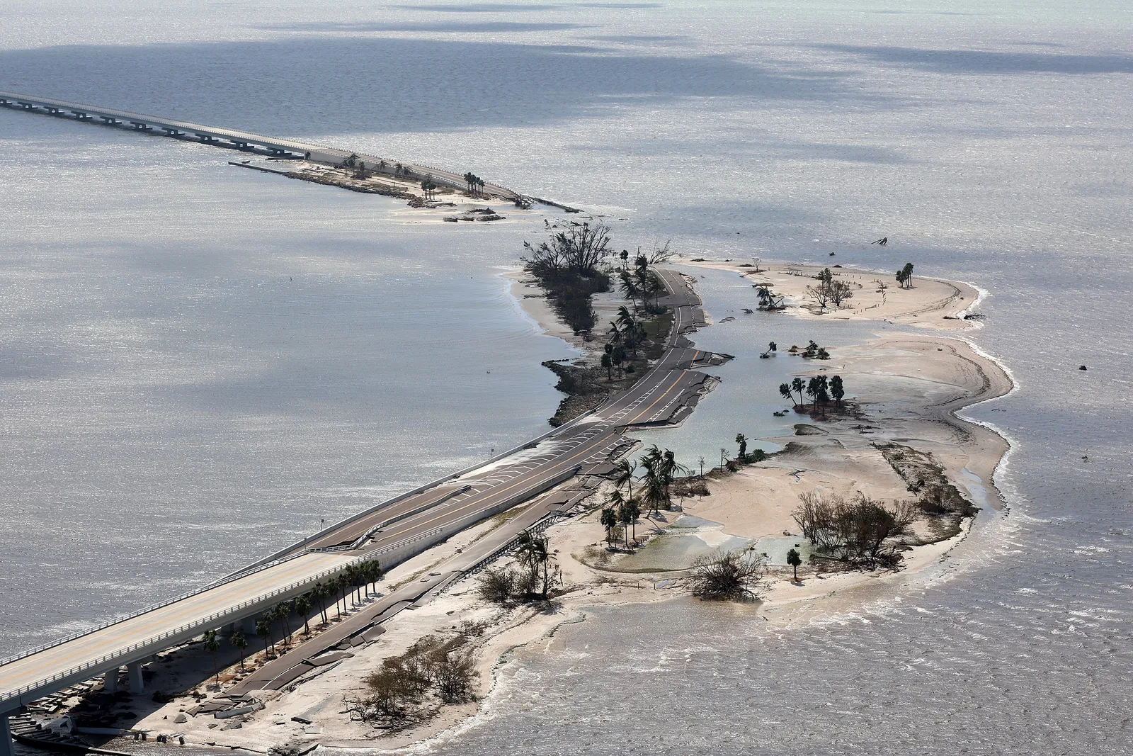 Parts of Sanibel Causeway are washed away along with sections of the bridge after Hurricane Ian passed through the area on Sept. 29, 2022, in Sanibel, Florida.