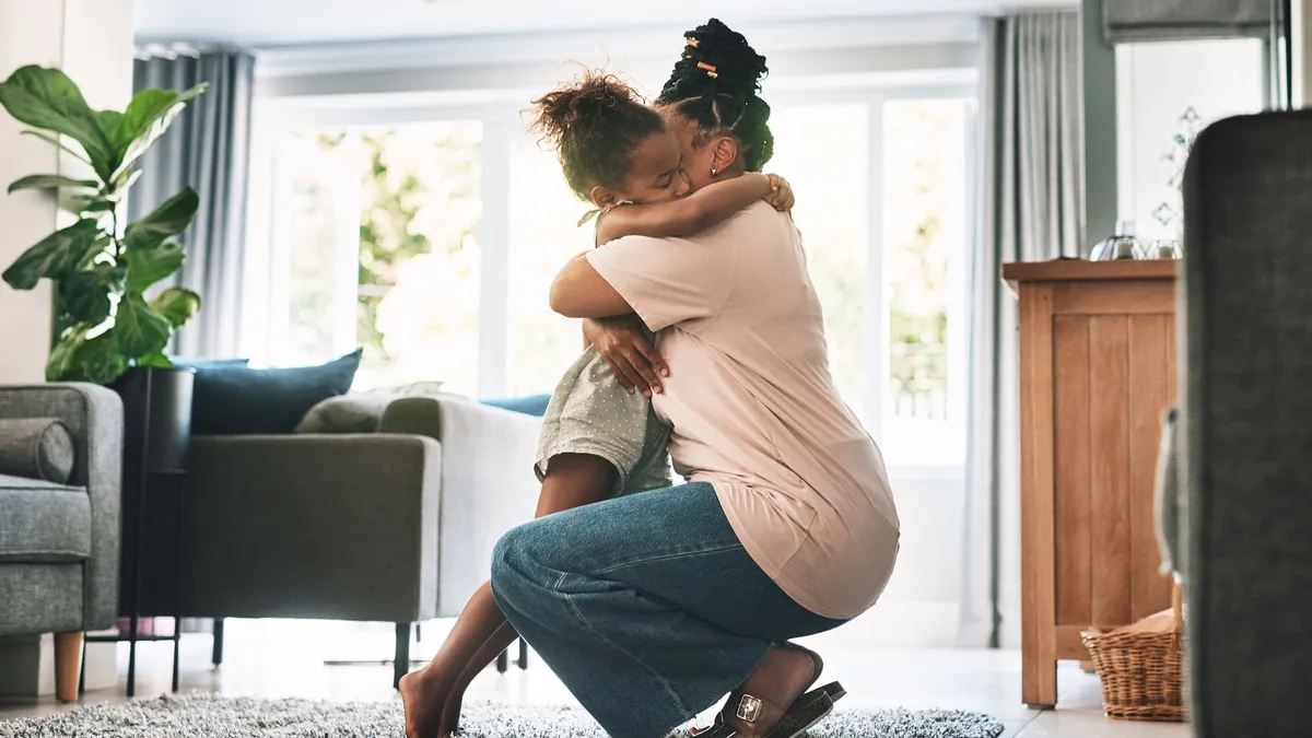 Mother hugging child