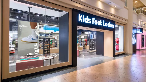 A storefront with the words "Kids Foot Locker" on the front.