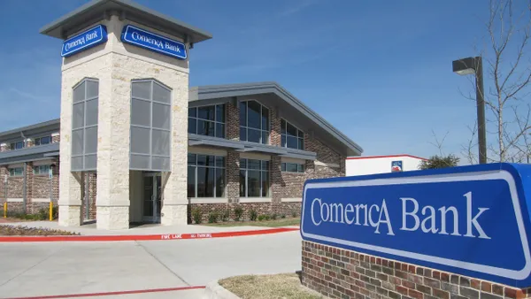 A building is shown with a sign that reads, "Comerica Bank" in the foreground