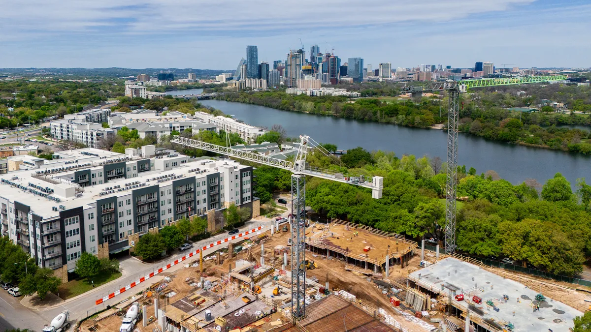 In an aerial view, the groundwork for apartments is seen undergoing construction on March 19, 2024 in Austin, Texas