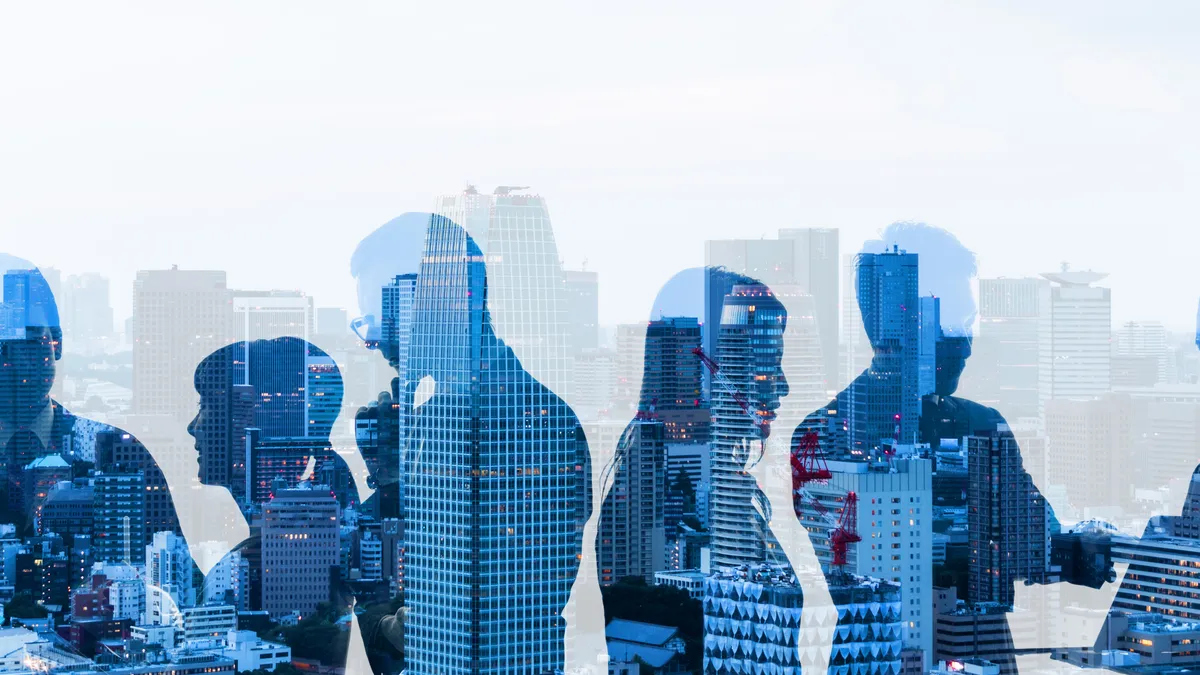 Silhouette with group of businesspeople and cityscape.