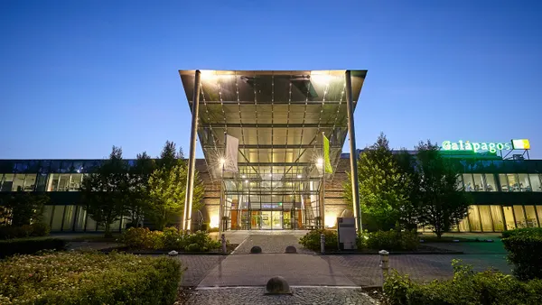 The entrance to Galapagos' corporate offices are lit up at dusk.