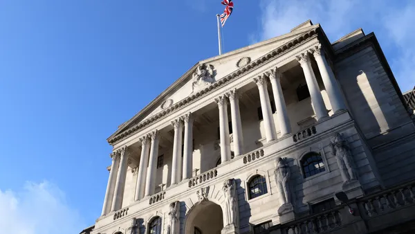 Low angle view of the Bank of England building, Threadneedle Street with Union Jack flag. Threadneedle Street. London