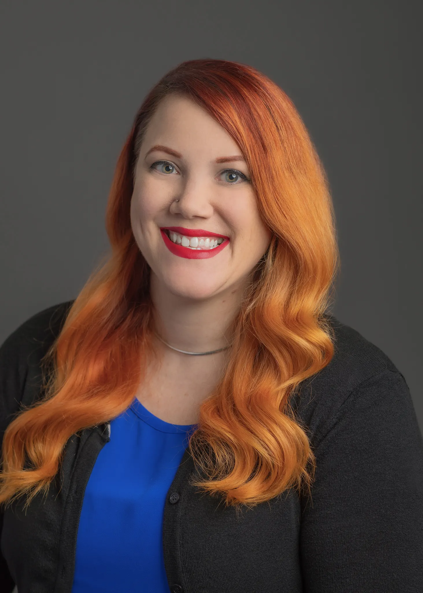 A professional headshot of Devin Lusk