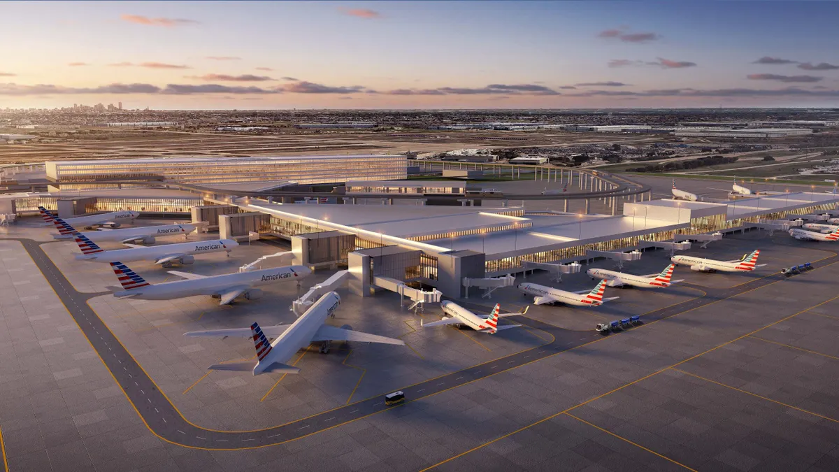 Aerial view of DFW's new and expanded Terminal F, ringed with airplanes.