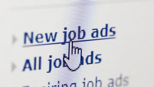 Looking for new job on internet ads - stock photo