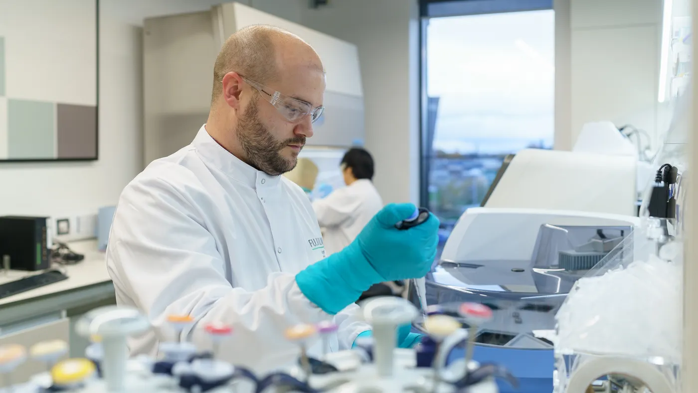 A lab member using lab equipment