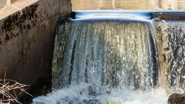 A close up of water flowing along a river.
