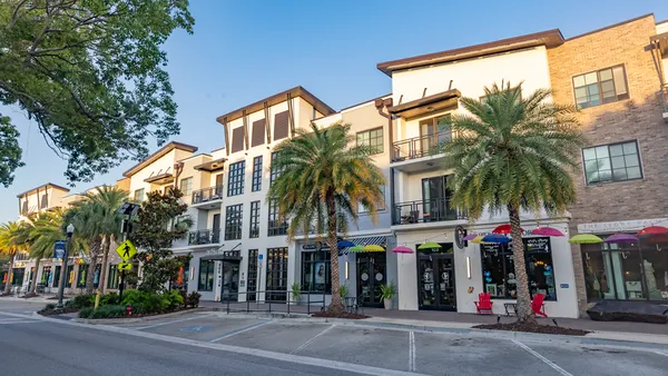 A row of multipurpose business and apartment buildings.