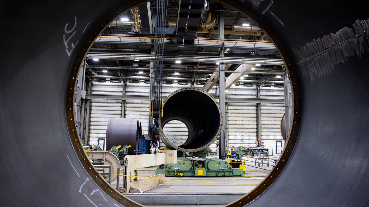 Wind turbine towers sit under construction at CS Wind on November 29, 2023 in Pueblo, Colorado.