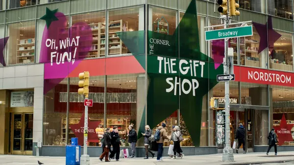 People walking by Nordstrom's New York City store at the holidays.