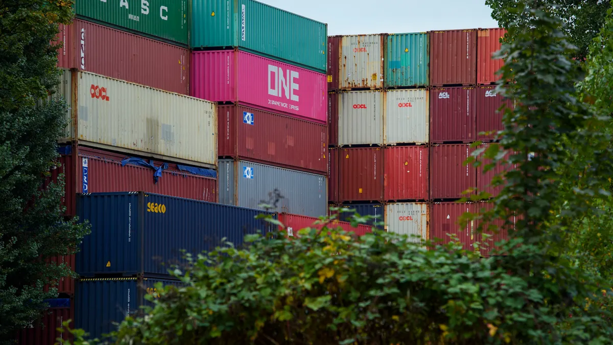 Shipping containers stand stacked at Hamburg Port on October 5, 2022.