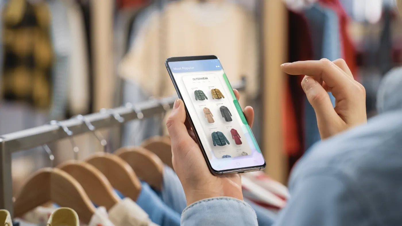 A phone screen showing someone online shopping