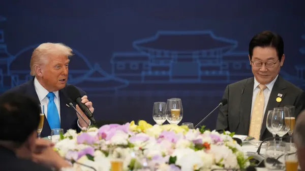 U.S. President Donald Trump speaks at a dinner next to South Korea President Lee Jae Myung on Oct. 29, 2025, in Gyeongju, South Korea.