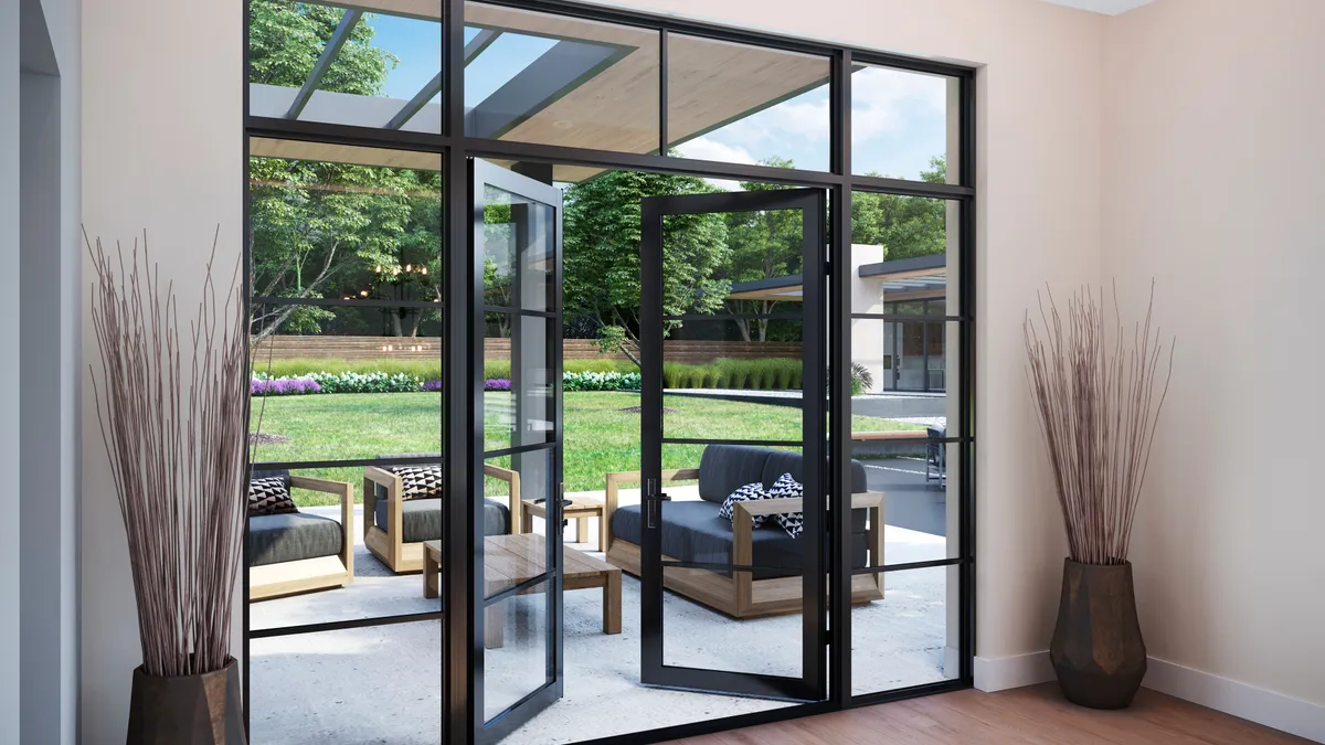 A patio door opening surrounded by windows.