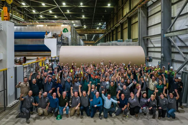 Workers celebrate at Cascades Containerboard Packaging plant in Bear Island, Virginia