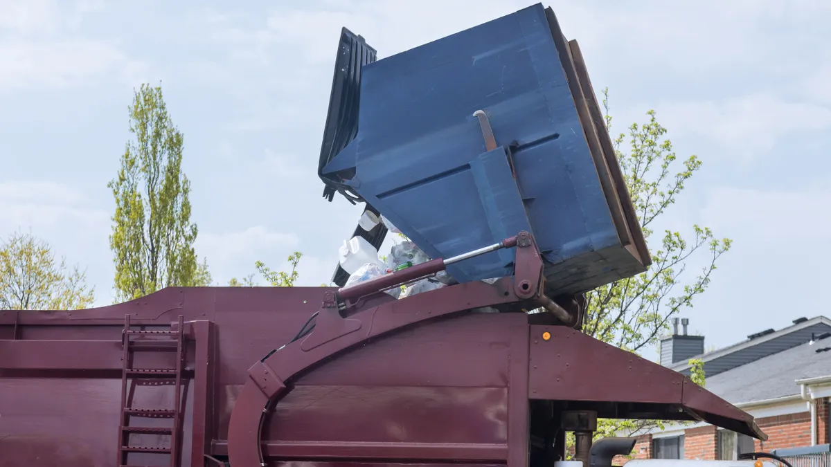 Waste truck collecting container