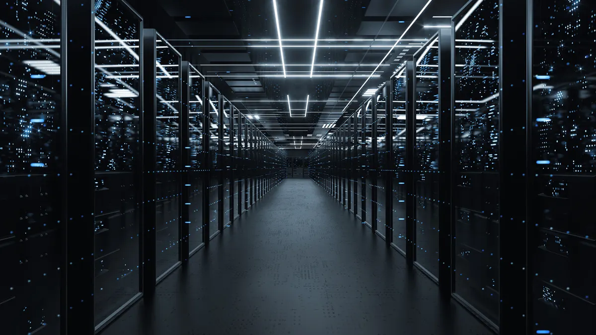 a server room aisle with server racks at either side
