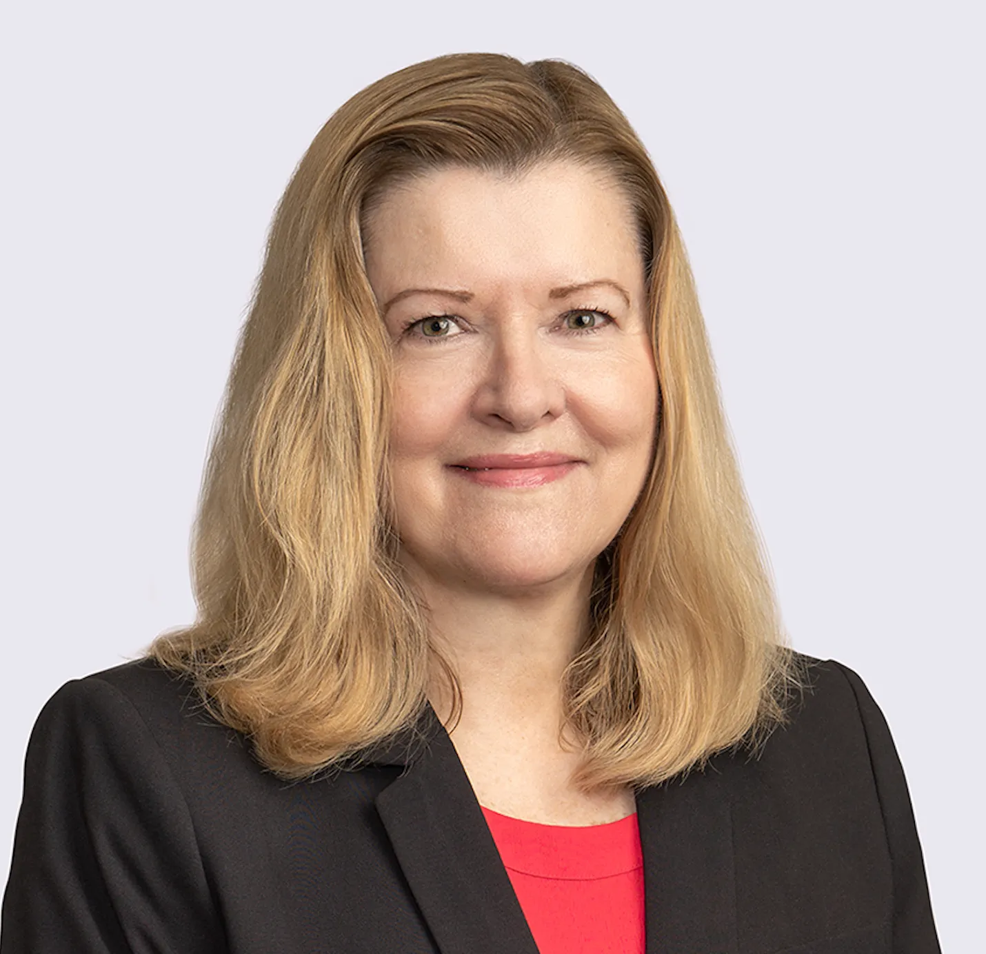 A portrait photograph shows a woman attorney in business attire.