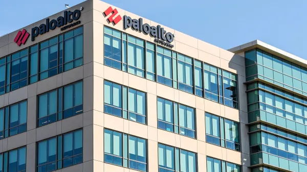 Beige and blue modern office building with large windows and the “paloalto networks” logo in black and red near the top corners.