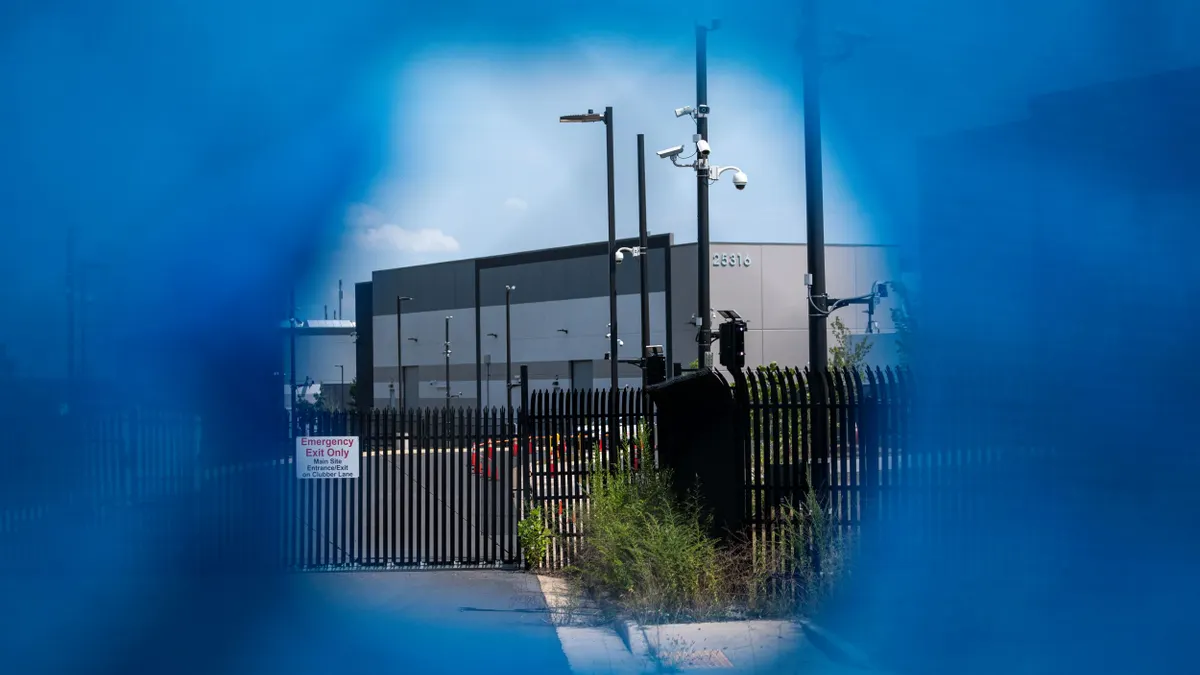 a large building seen through a hole