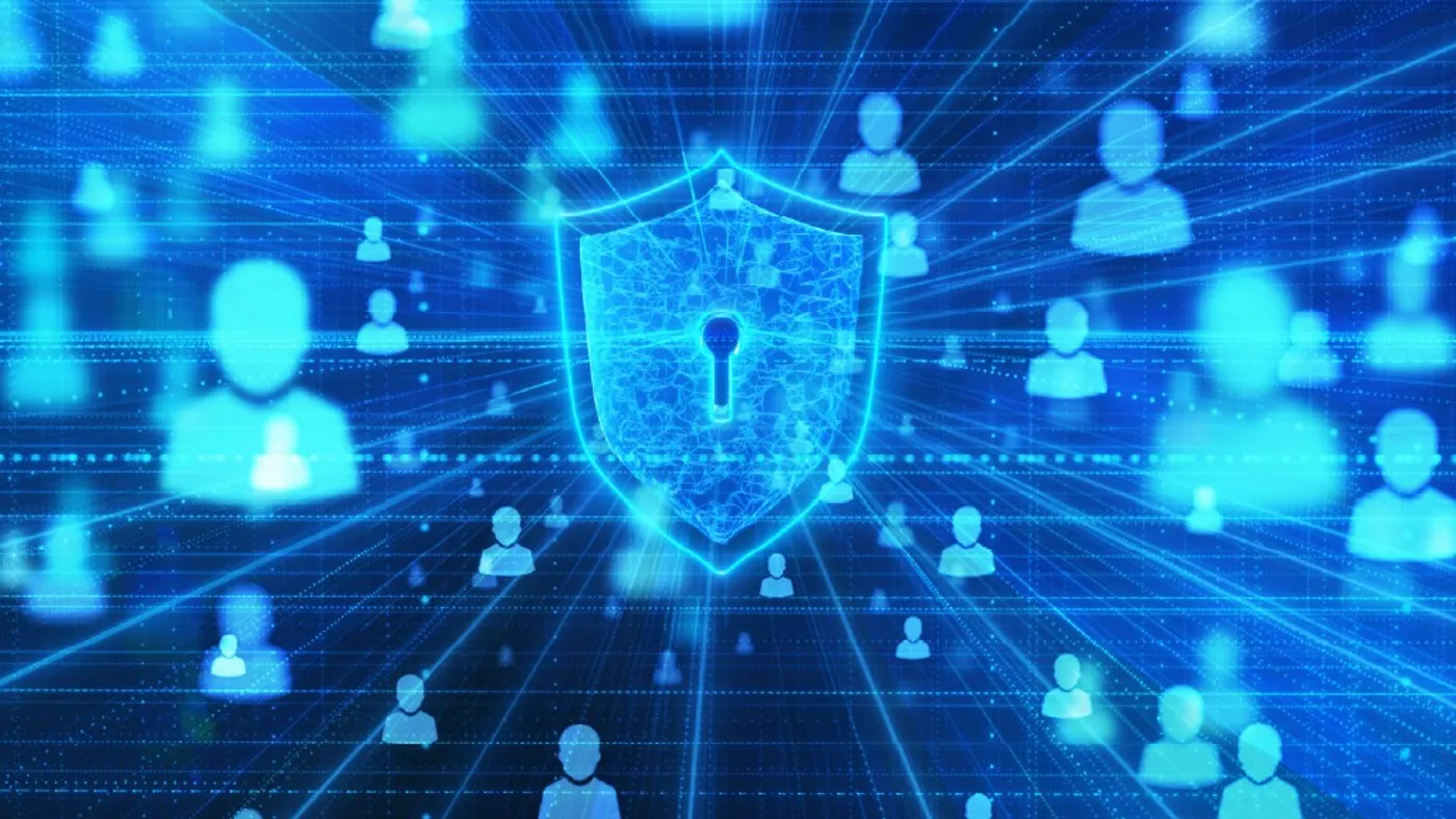 A digital security shield with a keyhole is surrounded by blue silhouettes of people on a grid, symbolizing online privacy and data protection.