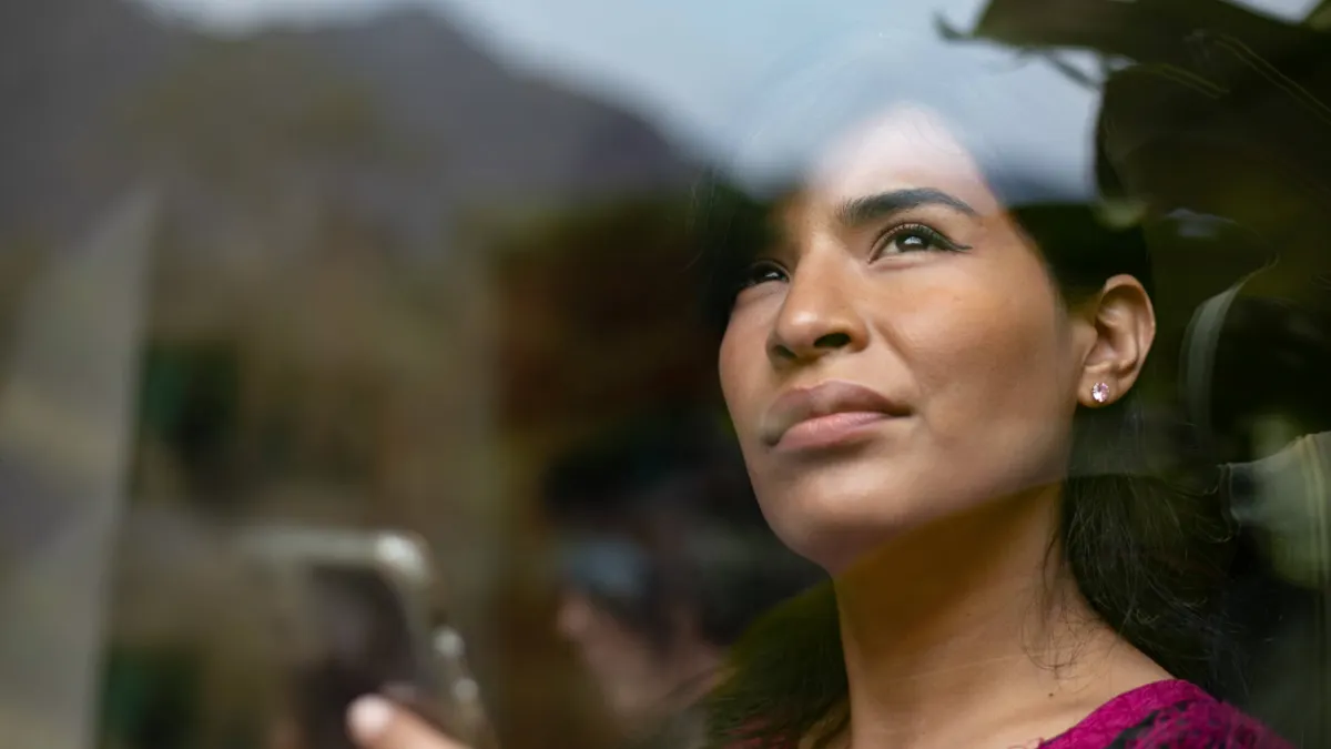 Woman staring out of the window