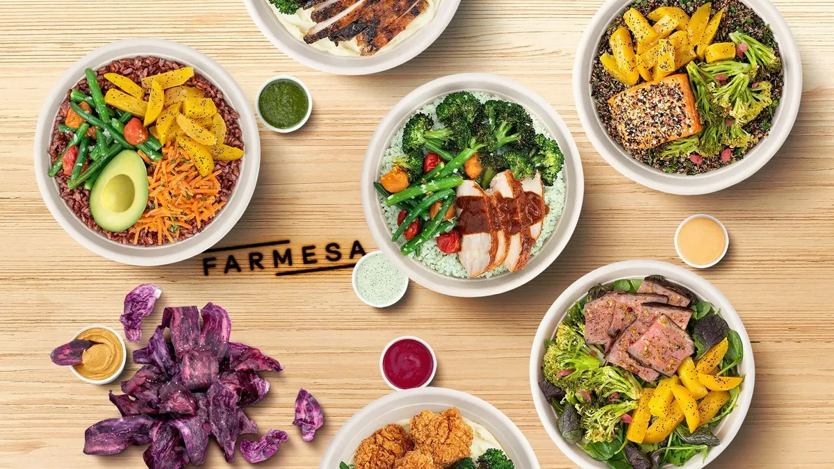 An image of food bowls from Chipotle's experimental fast casual brand, Farmesa Fresh Eatery.