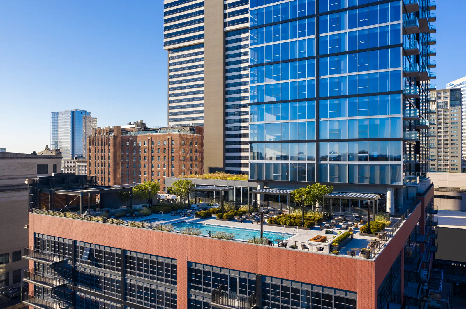 A modern apartment building against a city skyline.