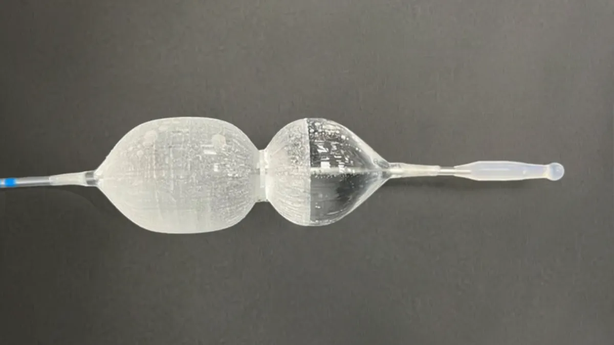 A clear, balloon-shaped device with two rounded halves connected to a catheter.