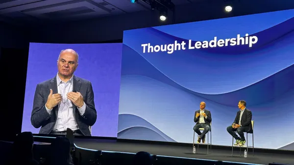 The Kraft Group CITO Michael Israel speaks on a stage at Gartner IT Expo/Symposium