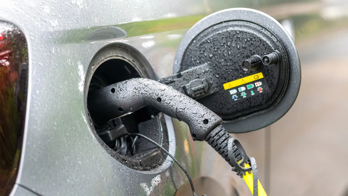 Charging a hybrid vehicle in the rain.