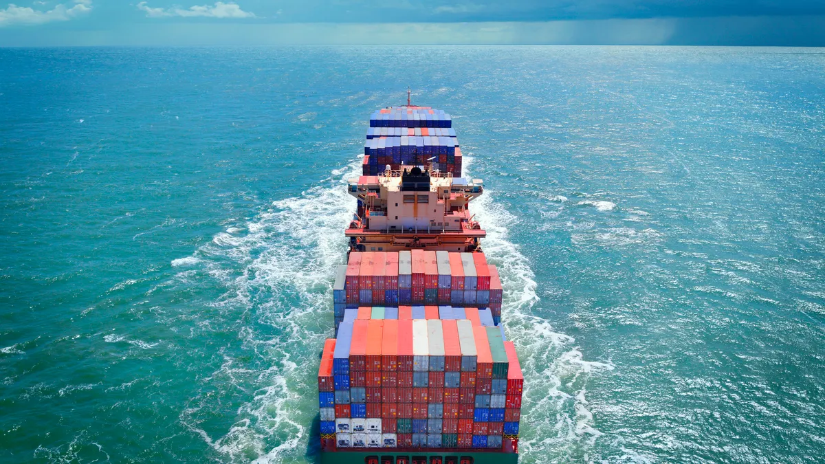 Aerial view of  cargo ship in the middle of the sea