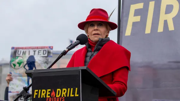 Jane Fonda at a podium during her 2020 protest series Fire Drill Fridays