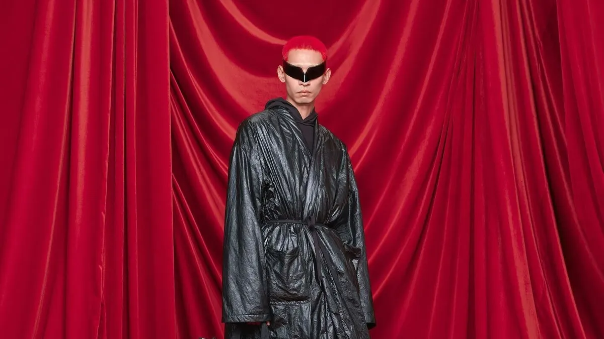 A model is pictured wearing a Balenciaga leather coat.