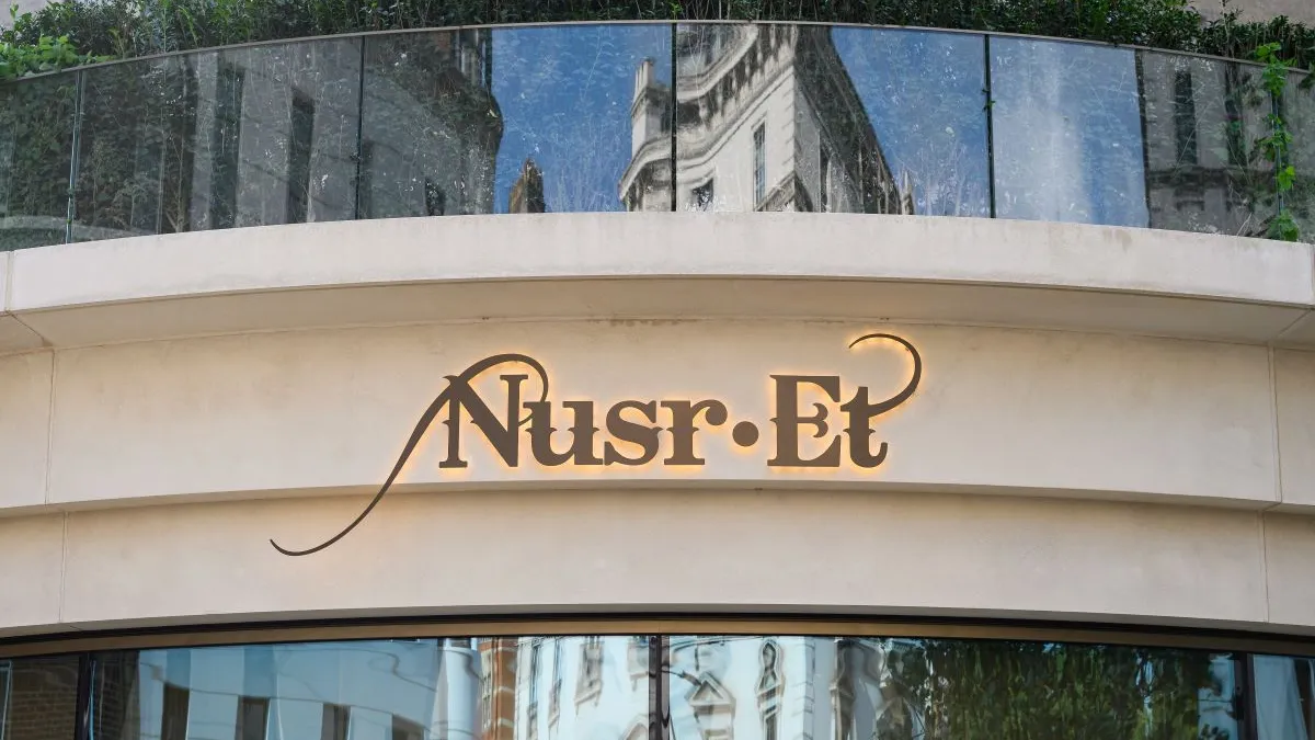 A beige building with gold signage that says "Nusr-Et"