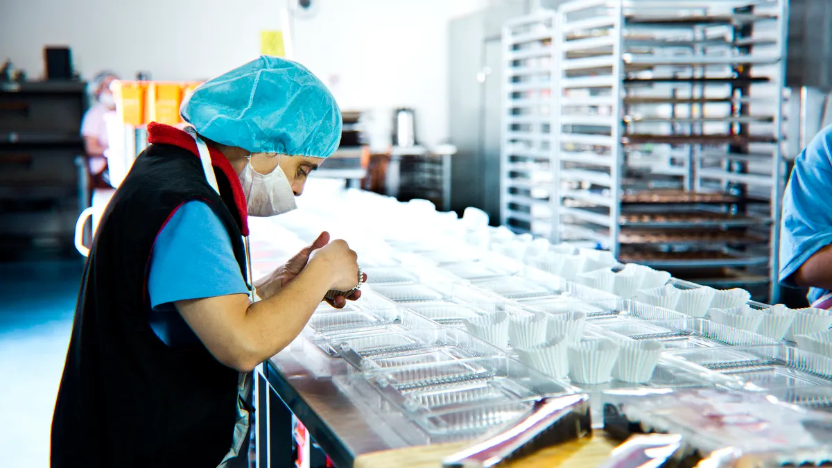 Person working at bakery facility