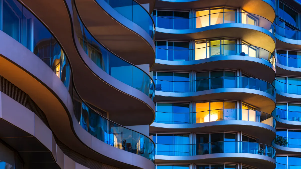 Building facade with illuminated windows at night