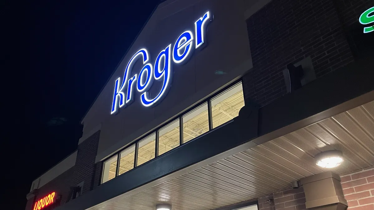 Exterior of a grocery store at night.
