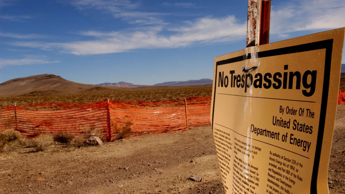 A no trespassing sign in a desert landscape