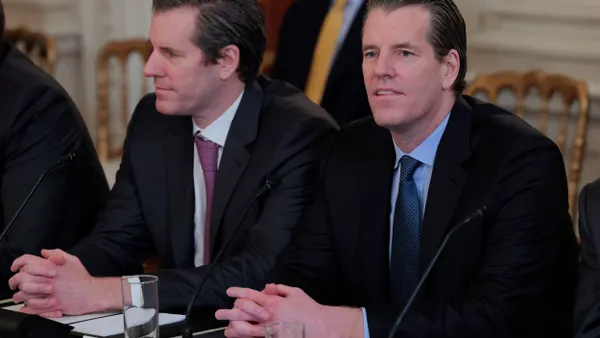 Gemini Trust founders the Winklevoss twins listen during President Trump's Digital Asset Summit