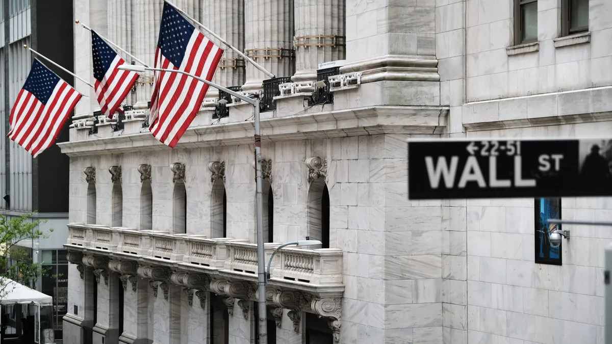 Flags fly outside the New York Stock Exchange building in New York City.