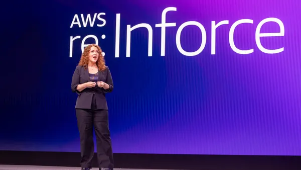 Amy Herzog on stage speaking during a conference