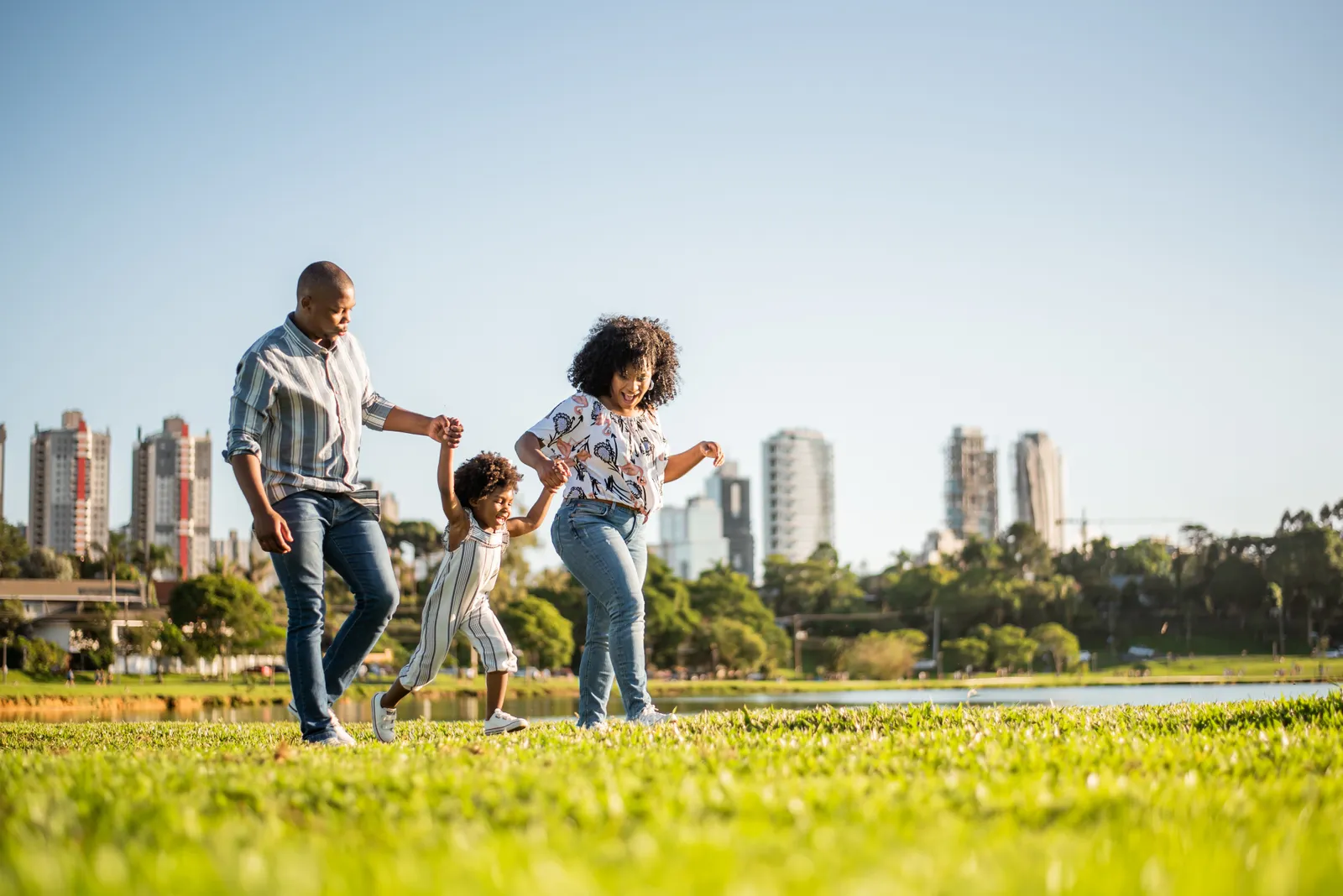 Family walking through an open field