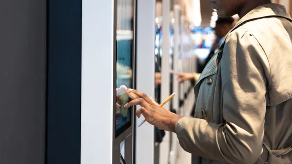 Person using a QBR touchscreen