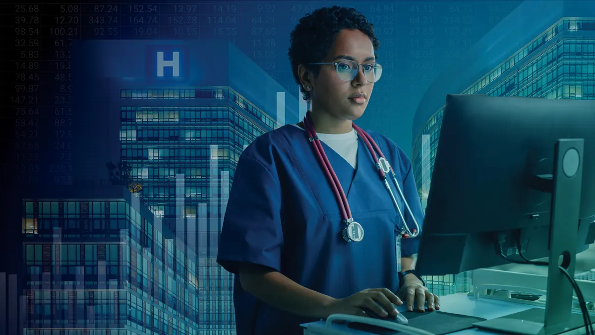 Nurse or doctor wearing stethoscope uses medical computer