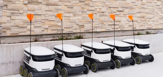 Autonomous delivery vehicles from Starship Technologies outside a Lucky California supermarket