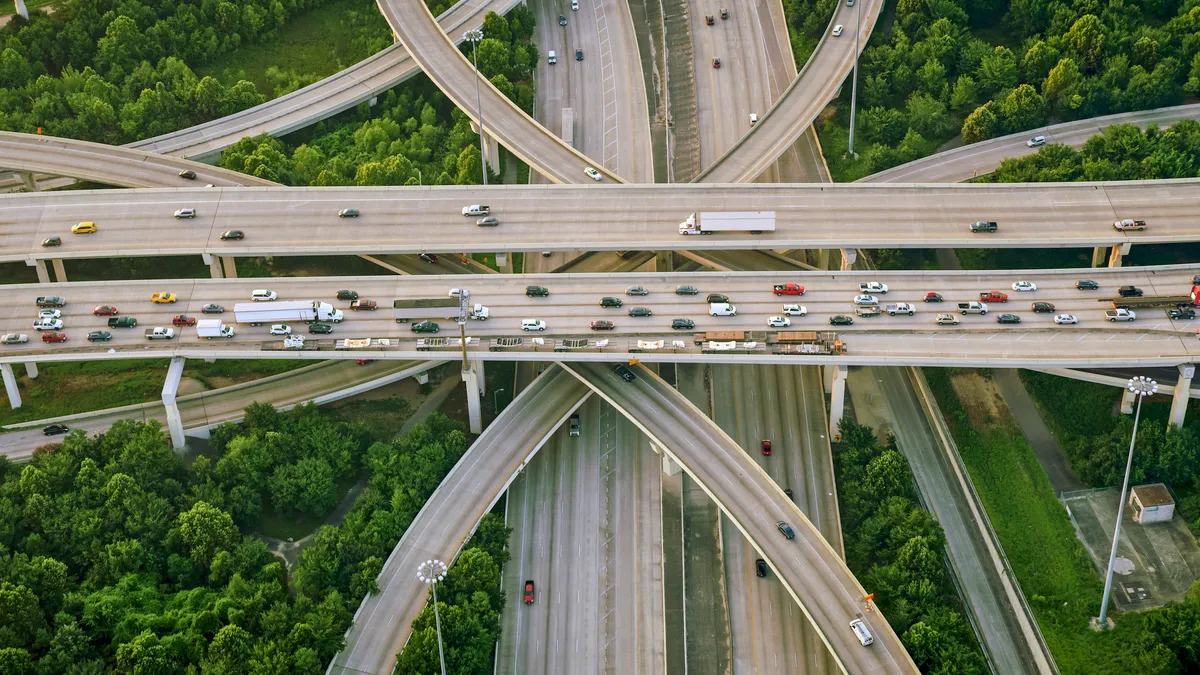 Trucks and cars traverse along the Beltway 8 highway in Houston.